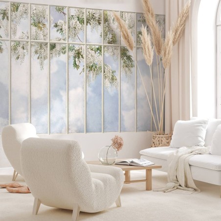 Large loft window with view on white wisteria wallpaper